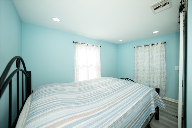570 Fm 232, Crockett, TX 75835 - bedroom featuring wood finished floors, recessed lighting, and baseboards