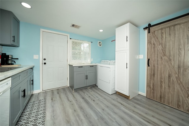 570 Fm 232, Crockett, TX 75835 - kitchen with washer / clothes dryer, dishwasher, gray cabinets, light wood-style floors, and light countertops