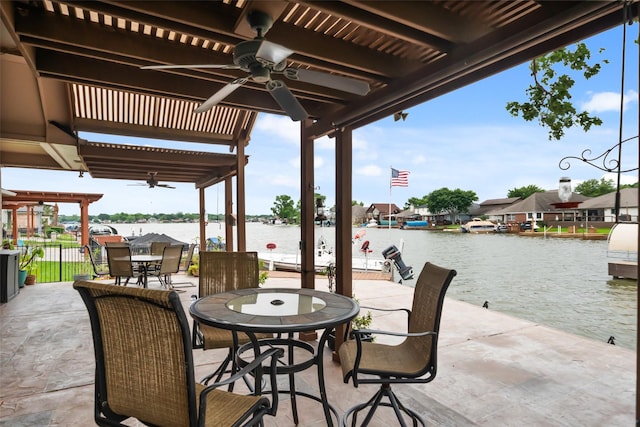 13685 Lakeside Place Dr, Willis, TX 77318 - view of patio / terrace featuring ceiling fan, outdoor dining area, and a water view