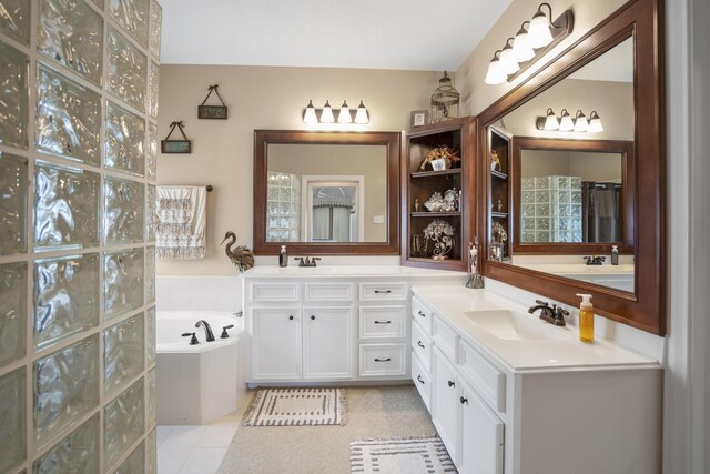 13685 Lakeside Place Dr, Willis, TX 77318 - bathroom with double vanity and a bath