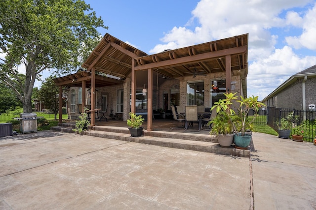 13685 Lakeside Place Dr, Willis, TX 77318 - rear view of house with a patio area