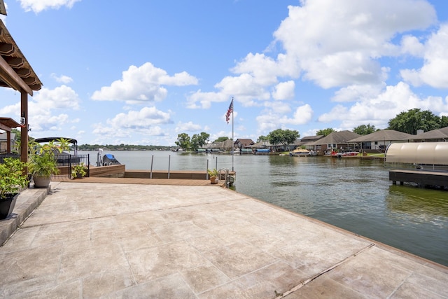 13685 Lakeside Place Dr, Willis, TX 77318 - view of patio / terrace featuring a water view and a boat dock