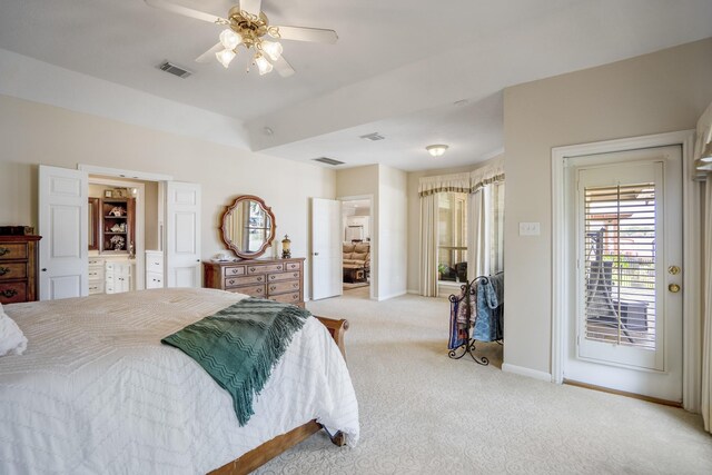 13685 Lakeside Place Dr, Willis, TX 77318 - bedroom with light colored carpet, access to outside, and ceiling fan