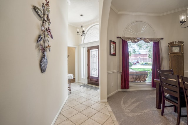 13685 Lakeside Place Dr, Willis, TX 77318 - entryway featuring a chandelier, ornamental molding, light tile patterned floors, and light carpet