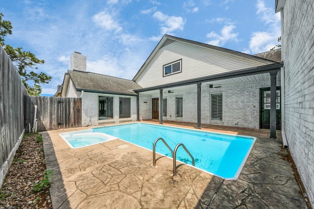 722 Merrick Dr, Sugar Land, TX 77478 - view of swimming pool featuring a fenced backyard, a ceiling fan, an in-ground hot tub, and a patio area