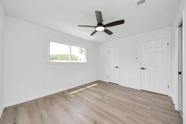 722 Merrick Dr, Sugar Land, TX 77478 - unfurnished bedroom featuring light wood-type flooring, baseboards, and ceiling fan