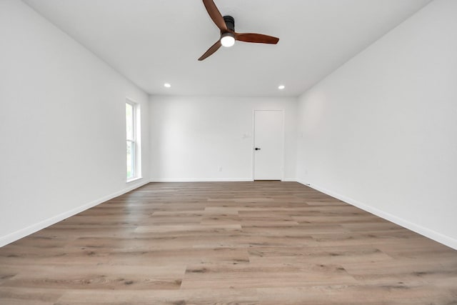 722 Merrick Dr, Sugar Land, TX 77478 - empty room with a ceiling fan, wood finished floors, recessed lighting, and baseboards