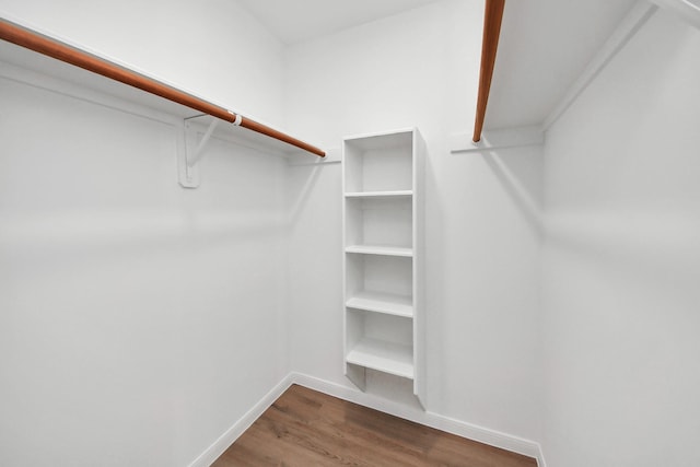 722 Merrick Dr, Sugar Land, TX 77478 - walk in closet with wood finished floors