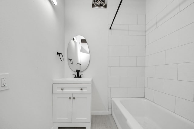 722 Merrick Dr, Sugar Land, TX 77478 - bathroom with vanity, baseboards, shower / bathtub combination, and wood finished floors