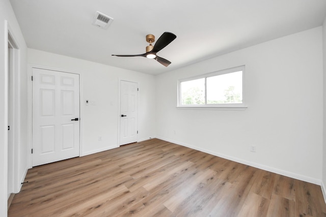 722 Merrick Dr, Sugar Land, TX 77478 - unfurnished bedroom featuring light wood-style floors, baseboards, and ceiling fan