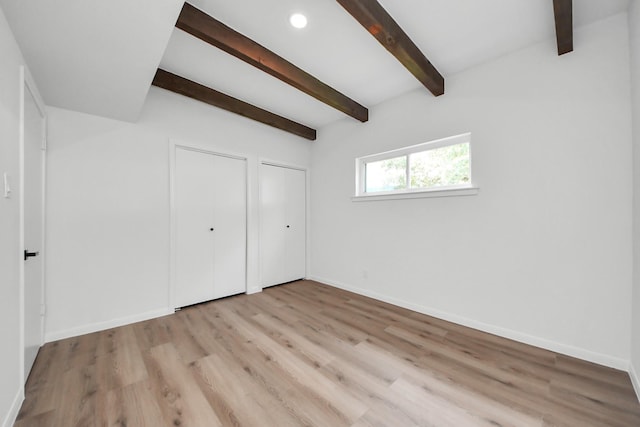 722 Merrick Dr, Sugar Land, TX 77478 - unfurnished bedroom with beam ceiling, light wood finished floors, baseboards, and recessed lighting