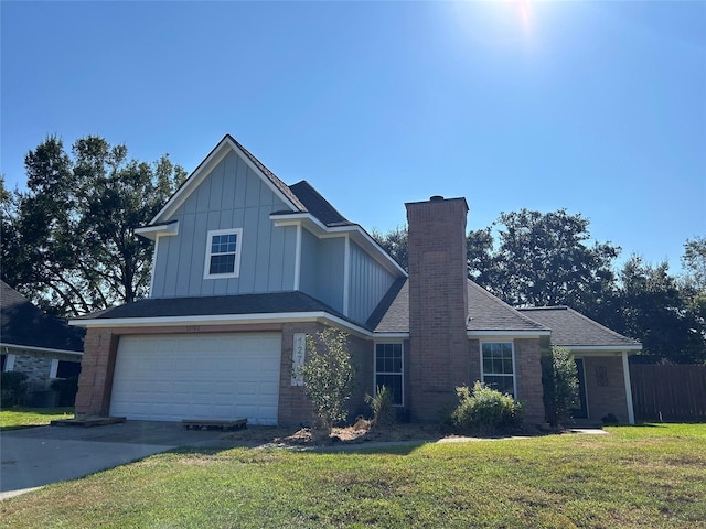 12702 River Bend Dr, Mont Belvieu, TX 77523 - view of front of home featuring a garage, board and batten siding, concrete driveway, a chimney, and brick siding