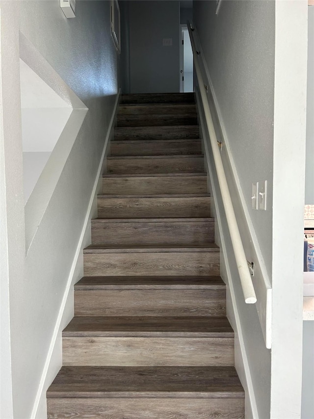 12702 River Bend Dr, Mont Belvieu, TX 77523 - staircase featuring wood finished floors