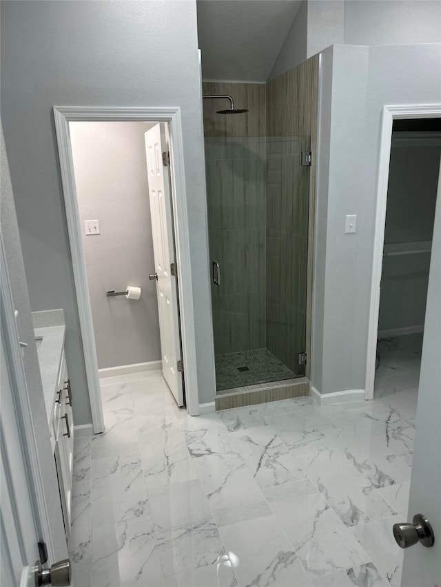 12702 River Bend Dr, Mont Belvieu, TX 77523 - full bath with a stall shower, vanity, baseboards, and marble finish floors