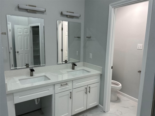 12702 River Bend Dr, Mont Belvieu, TX 77523 - bathroom featuring toilet, marble look tile flooring, double vanity, and baseboards