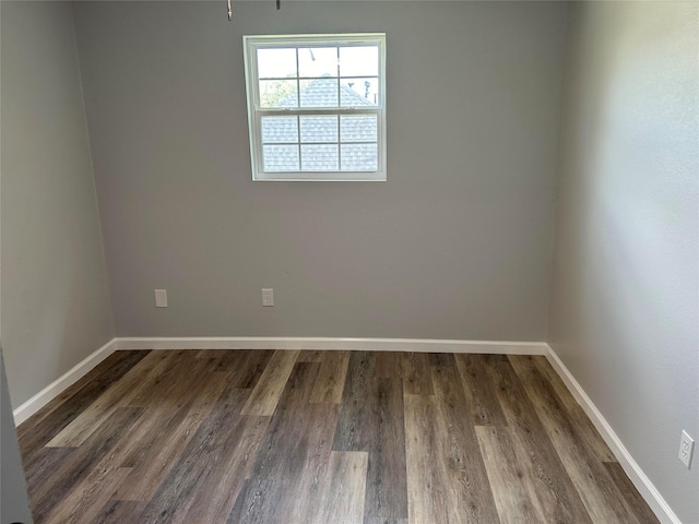 12702 River Bend Dr, Mont Belvieu, TX 77523 - spare room with wood finished floors and baseboards