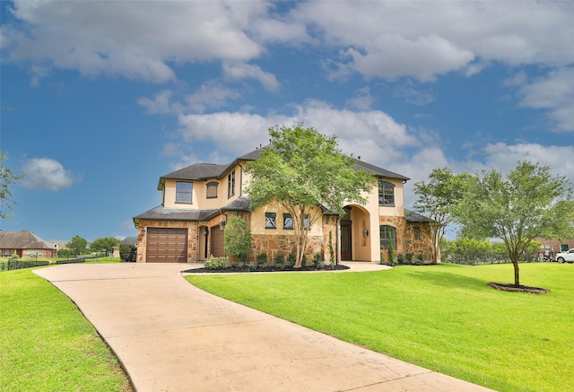 8410 Den Oak Dr, Richmond, TX 77406 - view of front facade featuring stone siding, driveway, an attached garage, and a front lawn