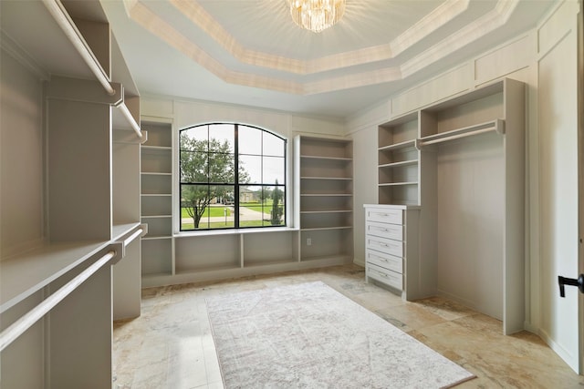 8410 Den Oak Dr, Richmond, TX 77406 - spacious closet featuring a tray ceiling and a chandelier