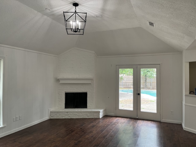 3714 Woodbriar Dr, Houston, TX 77068 - unfurnished living room featuring lofted ceiling, wood finished floors, french doors, a textured ceiling, and baseboards