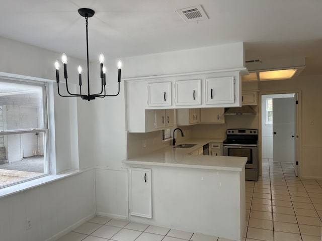 3714 Woodbriar Dr, Houston, TX 77068 - kitchen featuring electric stove, under cabinet range hood, a sink, light countertops, and light tile patterned flooring