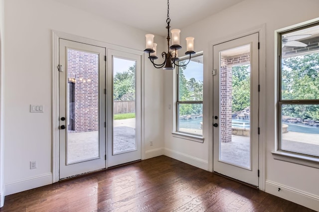 6 Freestone Stream Pl, Spring, TX 77389 - entryway with a chandelier, dark wood-style flooring, and baseboards