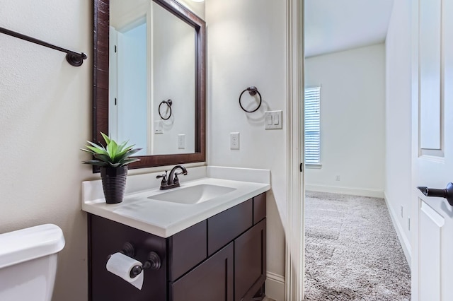 6 Freestone Stream Pl, Spring, TX 77389 - bathroom featuring vanity and toilet
