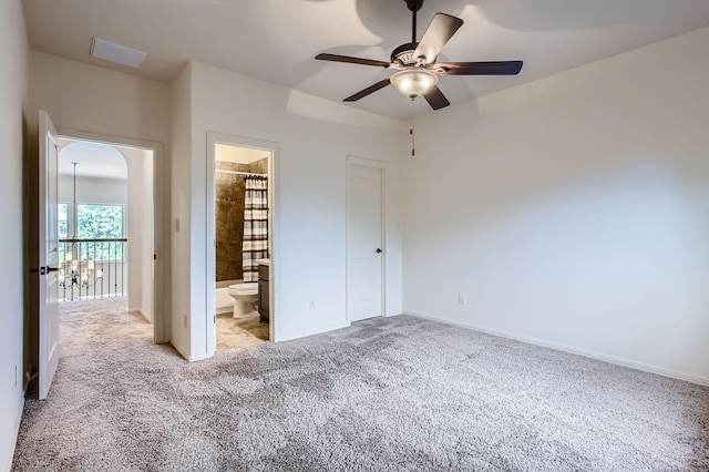 6 Freestone Stream Pl, Spring, TX 77389 - unfurnished bedroom with carpet, baseboards, connected bathroom, and ceiling fan