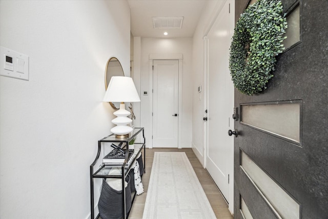 1026 Adele St, Houston, TX 77009 - entryway with wood finished floors, recessed lighting, and baseboards