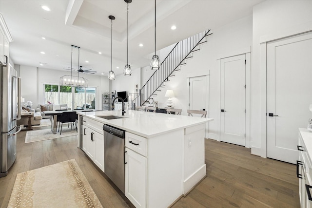 1026 Adele St, Houston, TX 77009 - kitchen with stainless steel appliances, a sink, open floor plan, recessed lighting, and hardwood / wood-style floors