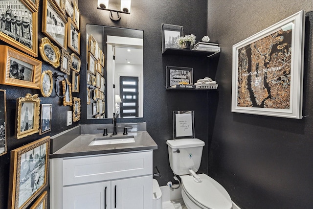 1026 Adele St, Houston, TX 77009 - half bath with toilet, vanity, and baseboards