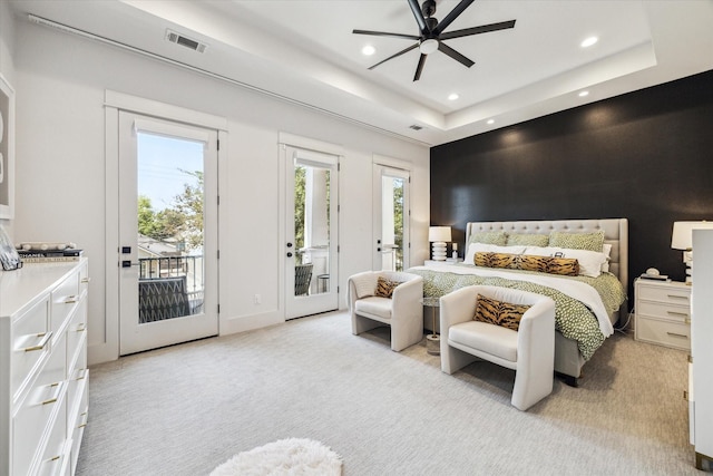1026 Adele St, Houston, TX 77009 - bedroom featuring recessed lighting, light carpet, access to exterior, and a raised ceiling