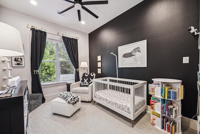 1026 Adele St, Houston, TX 77009 - bedroom with a crib, recessed lighting, baseboards, and ceiling fan