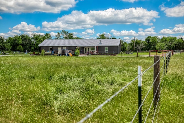 1850 Lcr 439, Groesbeck, TX 76667 - view of front of home with metal roof, a view of countryside, and board and batten siding