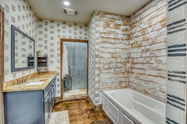 1850 Lcr 439, Groesbeck, TX 76667 - full bath with a garden tub, vanity, a walk in shower, and concrete floors