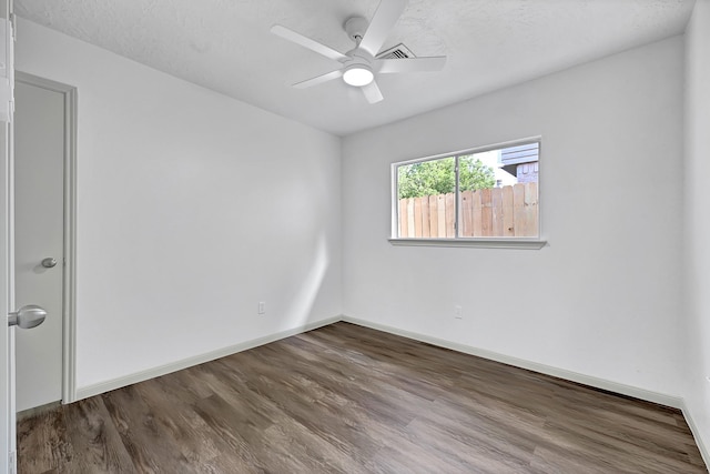 9911 Berry Limb Dr, Houston, TX 77099 - empty room featuring a ceiling fan, wood finished floors, and baseboards