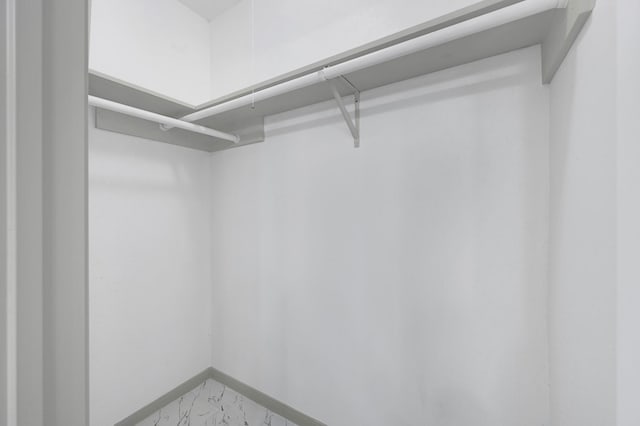 9911 Berry Limb Dr, Houston, TX 77099 - spacious closet featuring light marble finish floors