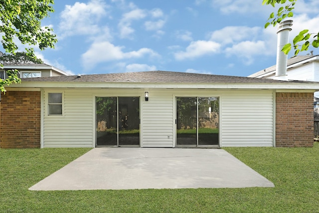 9911 Berry Limb Dr, Houston, TX 77099 - rear view of house with brick siding, a yard, and a patio area