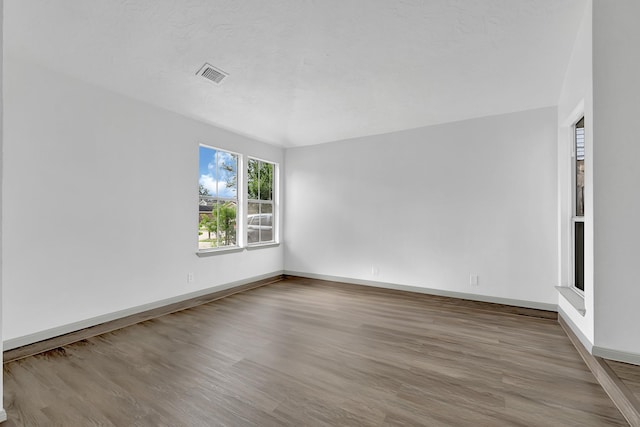 9911 Berry Limb Dr, Houston, TX 77099 - empty room featuring wood finished floors and baseboards