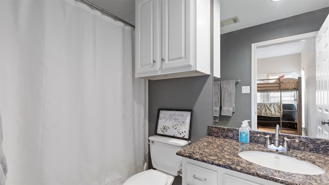 18725 Egret Oaks Ln, Webster, TX 77058 - bathroom with vanity, toilet, and curtained shower