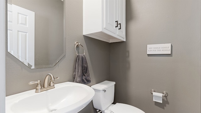18725 Egret Oaks Ln, Webster, TX 77058 - half bathroom with a sink and toilet