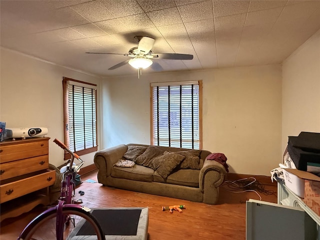 1509 Harry St, Victoria, TX 77901 - living area with wood finished floors, healthy amount of natural light, and a ceiling fan