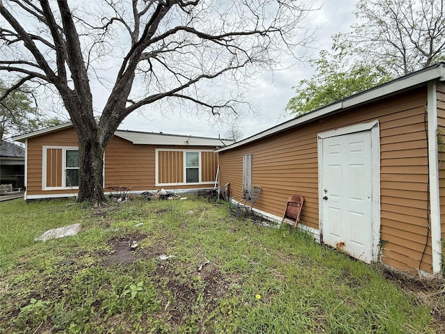 1509 Harry St, Victoria, TX 77901 - back of house with a yard