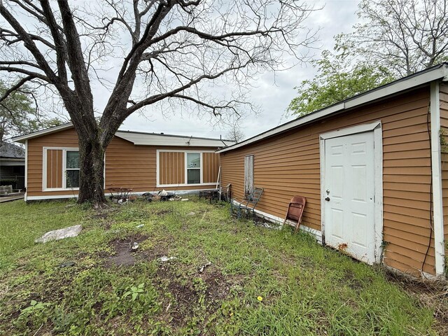 1509 Harry St, Victoria, TX 77901 - rear view of house with a yard