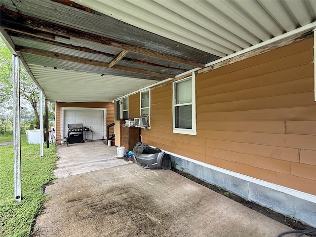 1509 Harry St, Victoria, TX 77901 - view of patio with grilling area, a garage, and concrete driveway