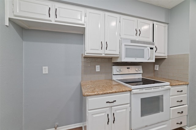 1271 Country Place Dr, Houston, TX 77079 - kitchen featuring white appliances, backsplash, white cabinetry, and baseboards