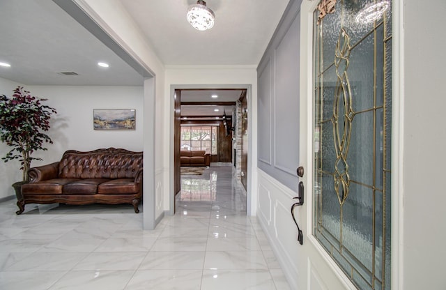 15014 Carol Chase Cir, Houston, TX 77489 - entryway featuring a decorative wall, light marble finish flooring, crown molding, and baseboards