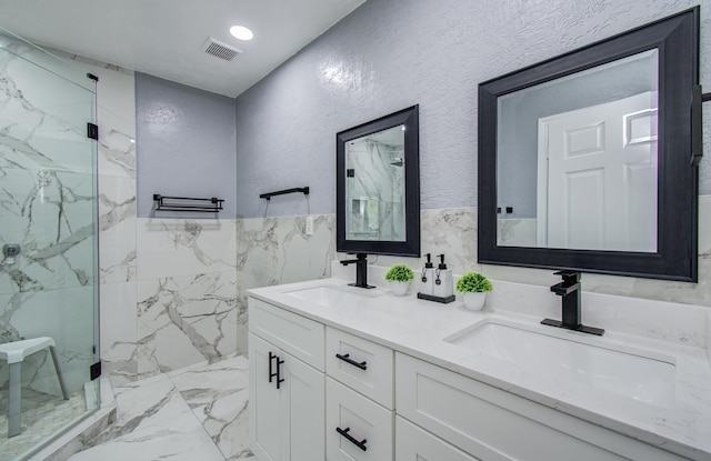 15014 Carol Chase Cir, Houston, TX 77489 - full bath featuring marble finish floors, a marble finish shower, double vanity, and tile walls