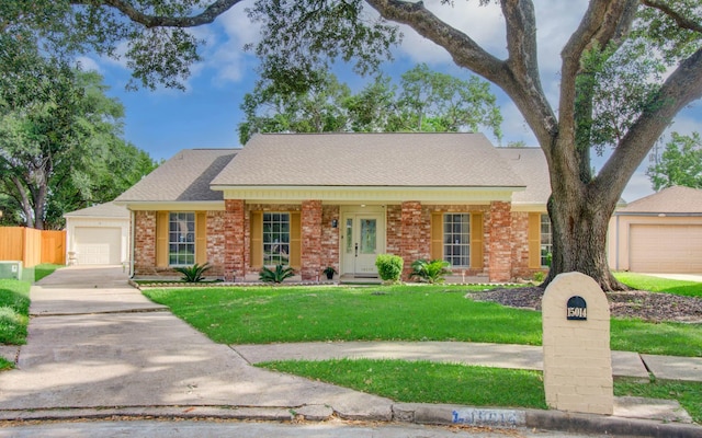 15014 Carol Chase Cir, Houston, TX 77489 - view of front of home featuring concrete driveway, a garage, brick siding, and roof with shingles