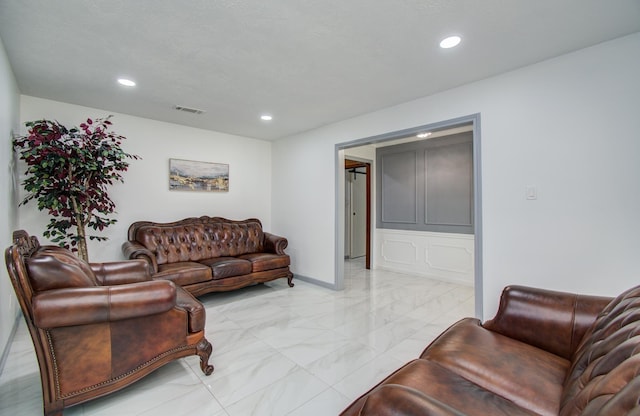 15014 Carol Chase Cir, Houston, TX 77489 - living room featuring light marble finish flooring, recessed lighting, and baseboards