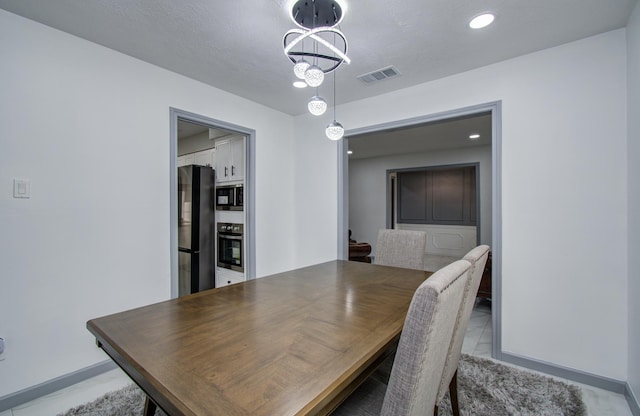 15014 Carol Chase Cir, Houston, TX 77489 - dining space with baseboards and a chandelier